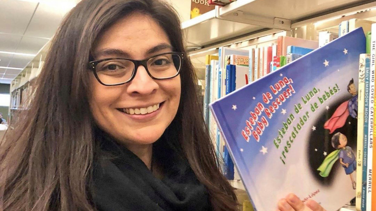 Mercado-Lopez with her children's book